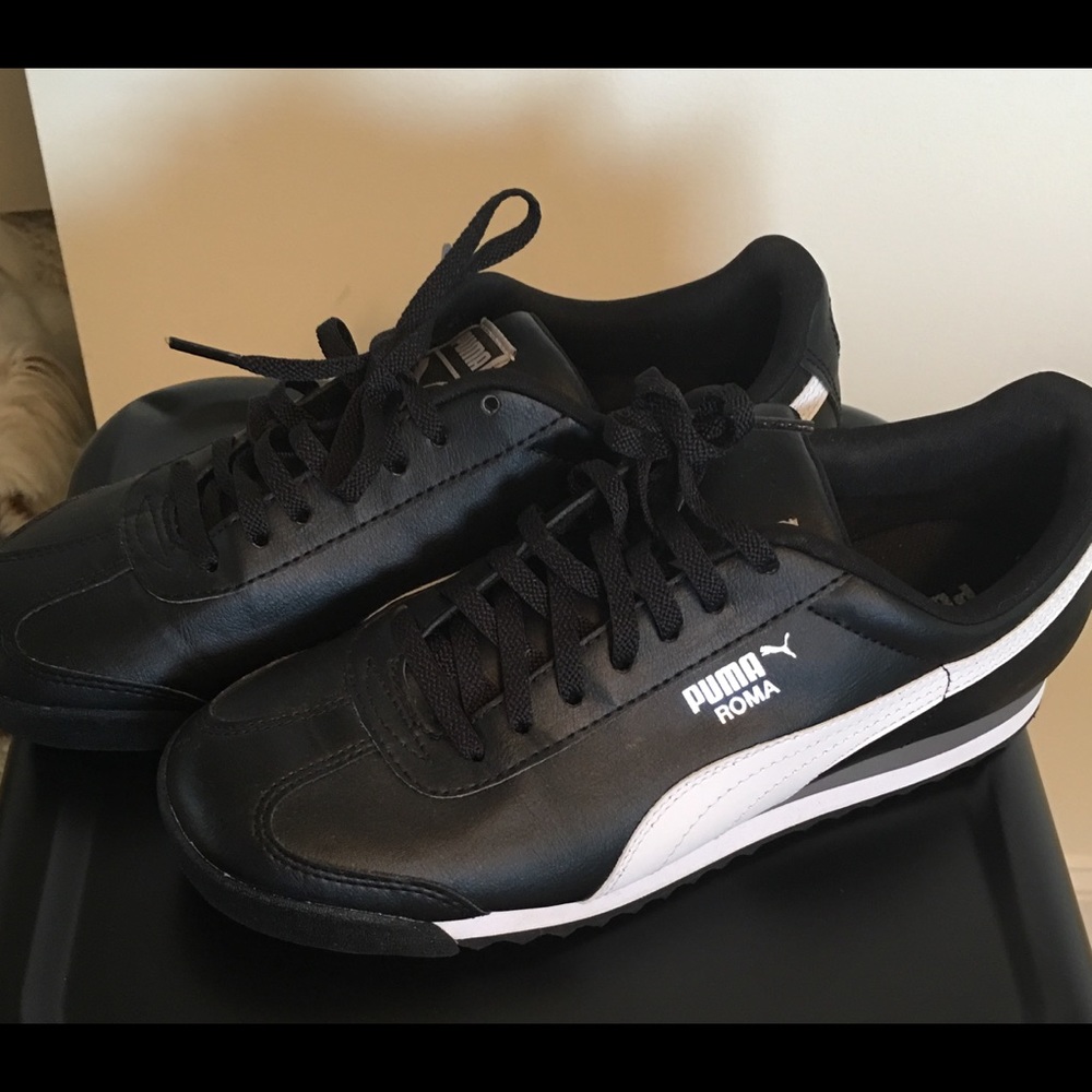 Black and white Pumas size 8